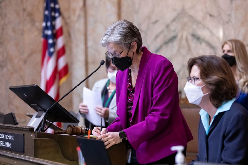 Speaker Jinkins signing paperwork at rostrum