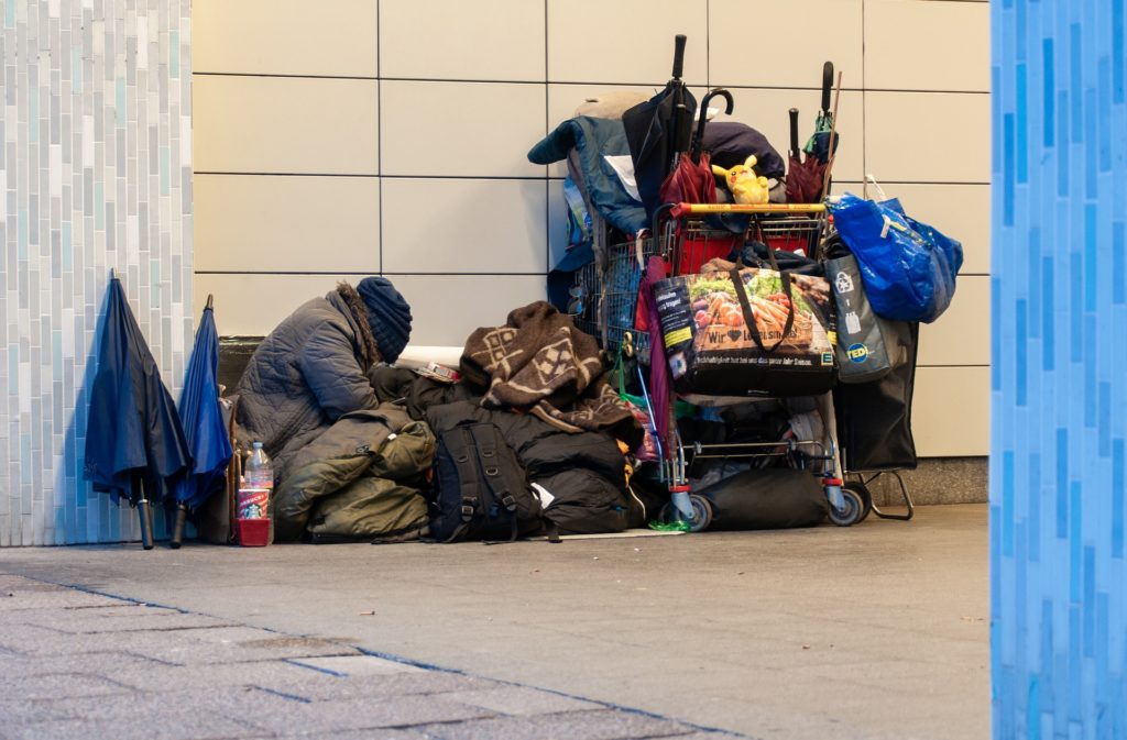 homeless person with belongings