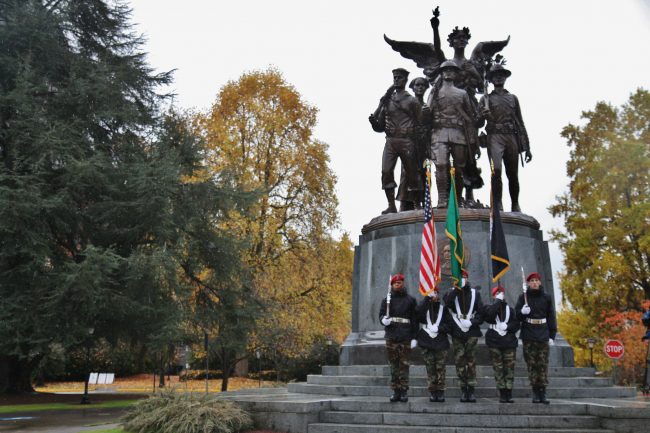 Color guard with flags at the WWI memorial on capitol campus