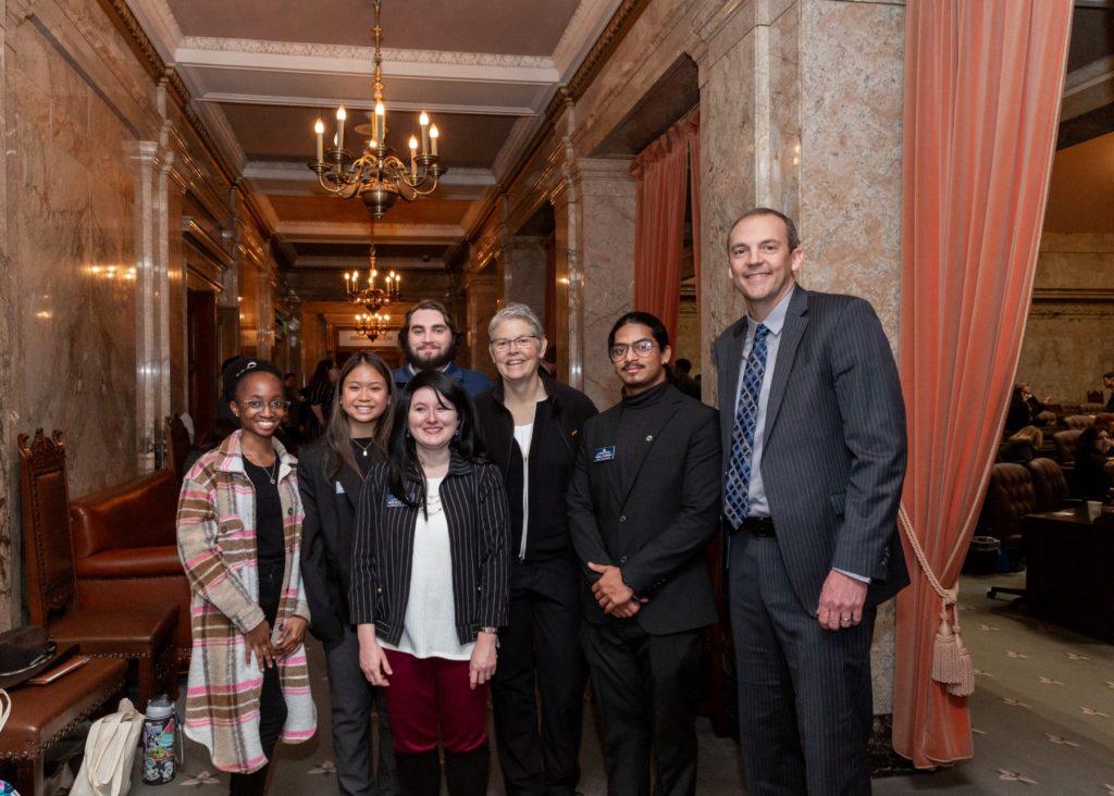 Rep. Marcus Riccelli and Speaker of the House Laurie Jinkins posing for a photo with student government leaders from community colleges of Spokane.
