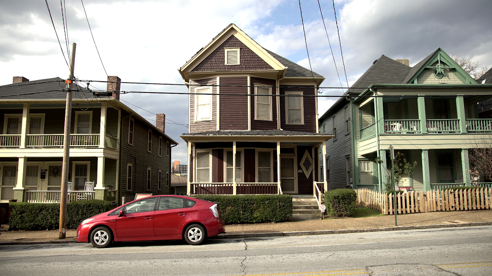 Houses with a Prius out front