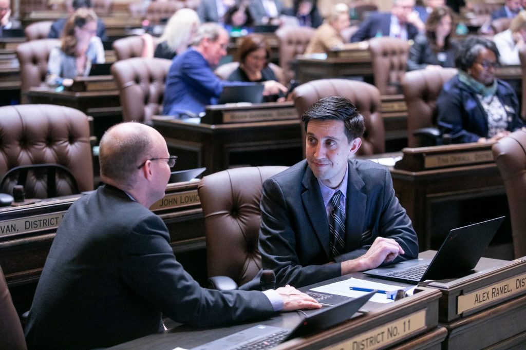 Rep. Alex Ramel at his desk on the floor