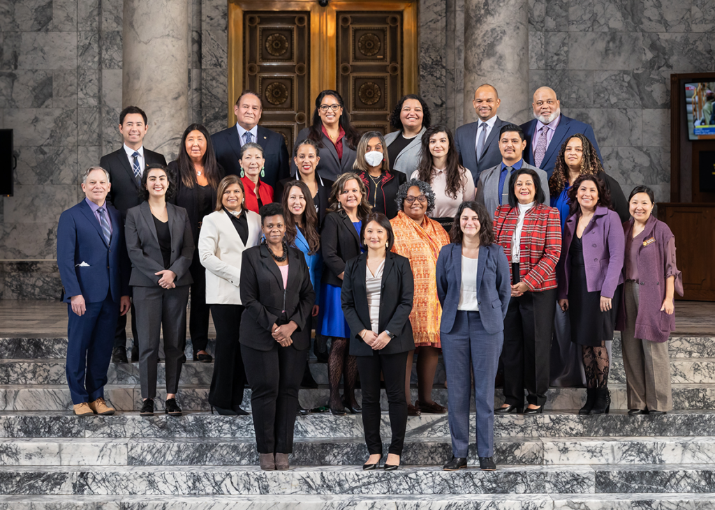 Photograph of the members of color caucus standing in the capitol building
