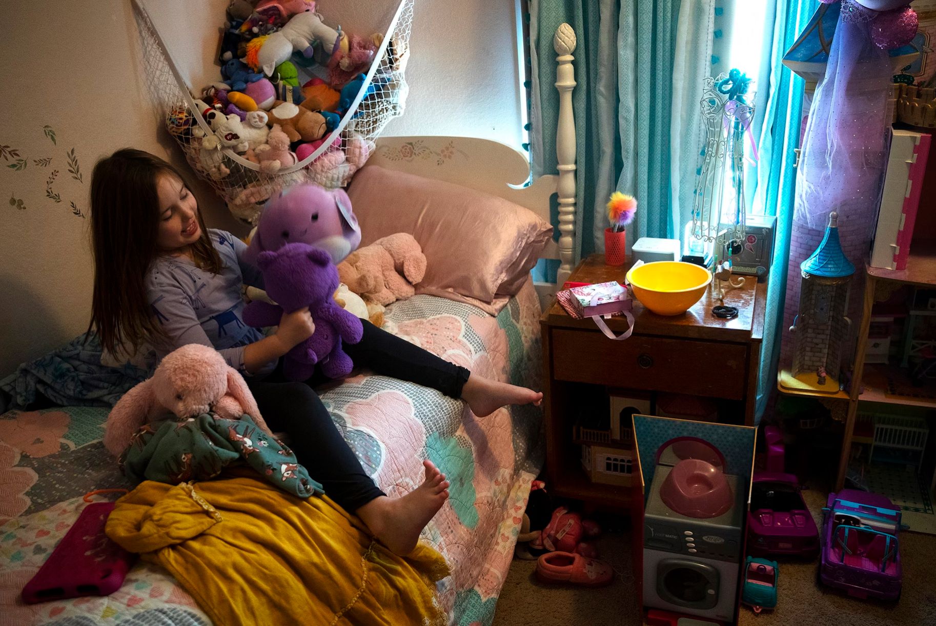 Lily Butler, 7, plays with stuffed animals in her bedroom after school on Wednesday, November 22, 2023, in Kenmore.