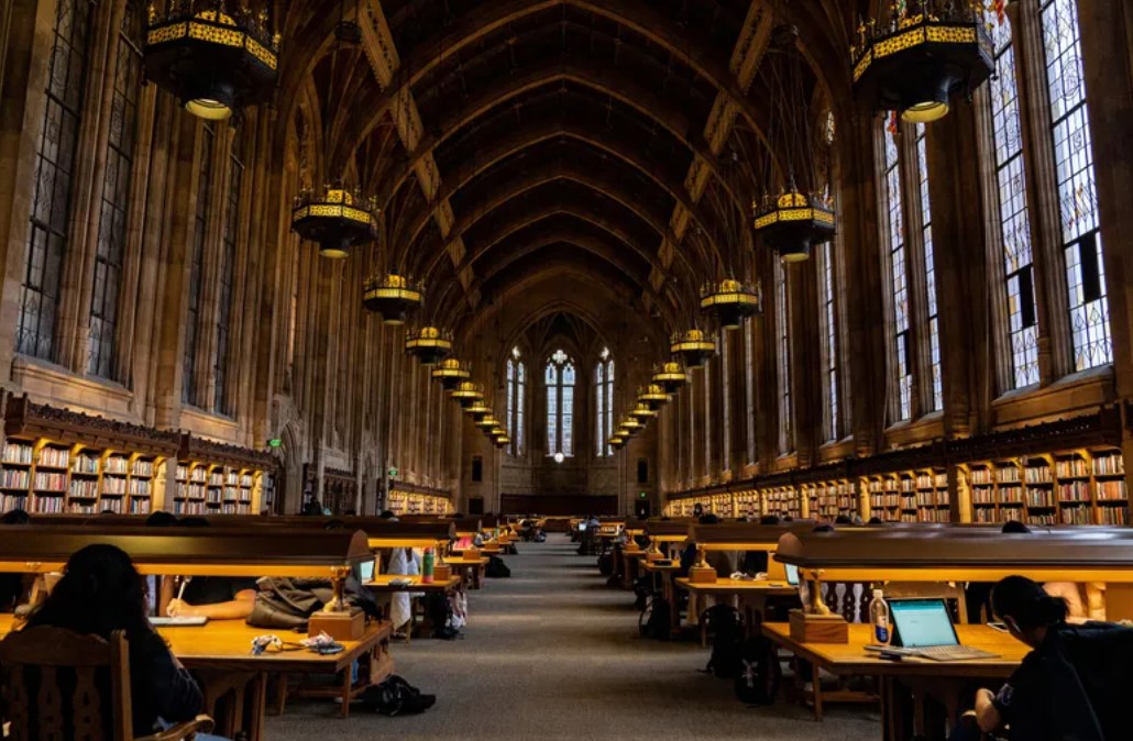 Students study in UW’s Suzzallo Library. The University of Washington’s director of admissions, said the institution is allowing a “small number” of students who do not yet have their financial... (Kylie Cooper / The Seattle Times, 2022